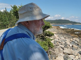 Ivan Dalen overlooking rocky Maine coastline